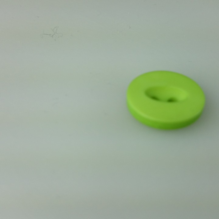Button for your outfits with elliptical hole at top image