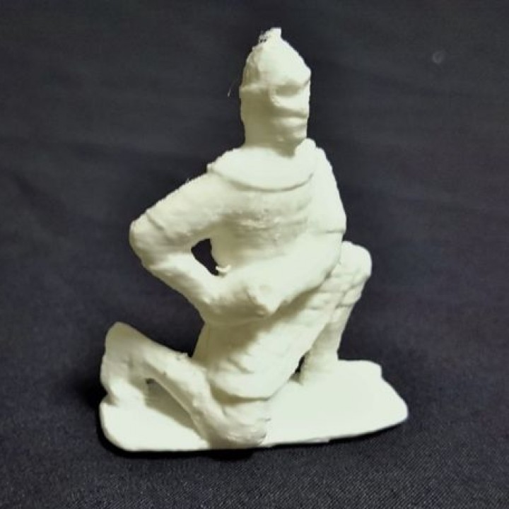 A seated army soldier image
