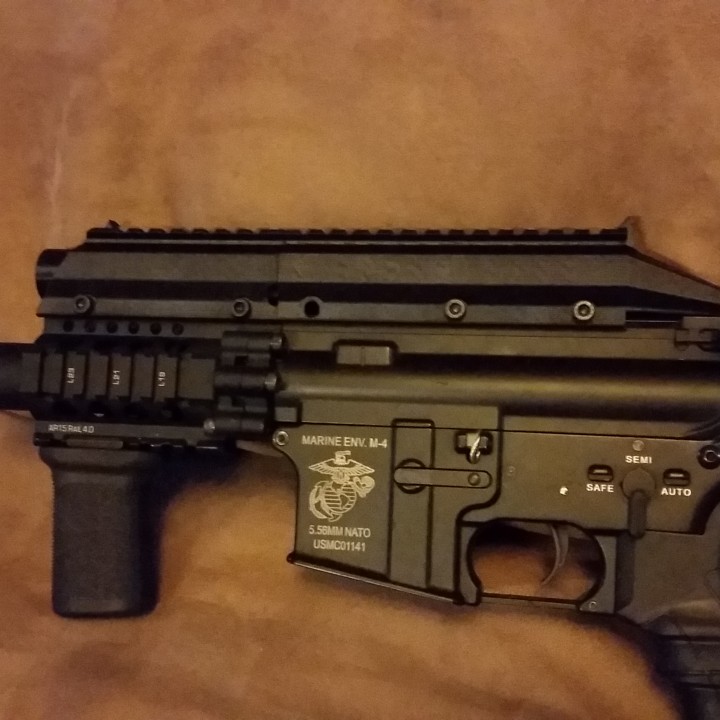 Airsoft M4 pistol rail riser and battery holder image