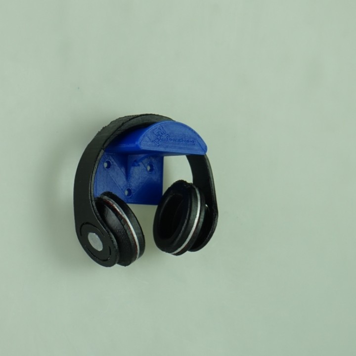 simplistic headphone holder with silverstone company name and logo with recognition of the designer AND INTEGRATED BOTTLE OPENER image