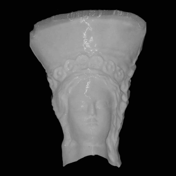 Head of a large terracotta statue of a female with a tall kalathos (basket-shaped) crown decorated with flowers at The British Museum, London image