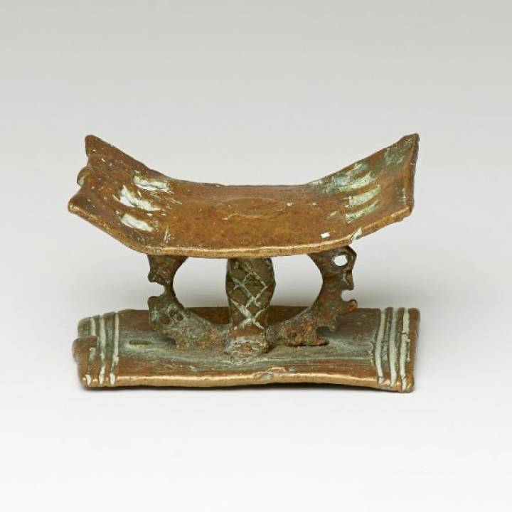 Gold weight in the form of an open-work Asante stool At The British Museum, London image