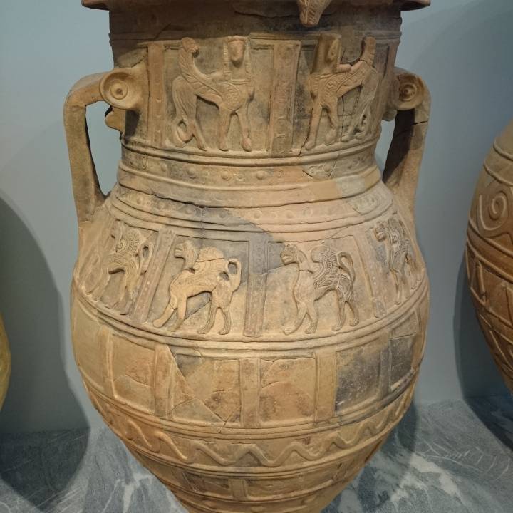 Pithos decorated with relief of sphinxes and griffins at The Heraklion Archaeological Museum, Greece image