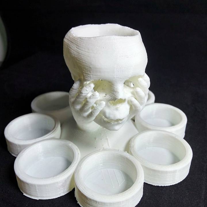 Skull in hand candle holder image