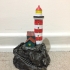 Lighthouse on a rock print image