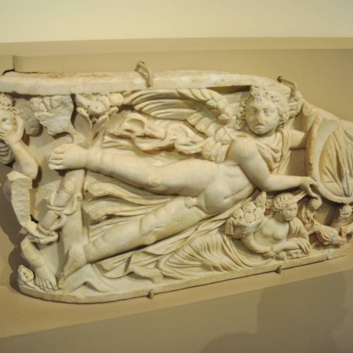 Fragment of Sarcophagus with Eros holding a Medallion image