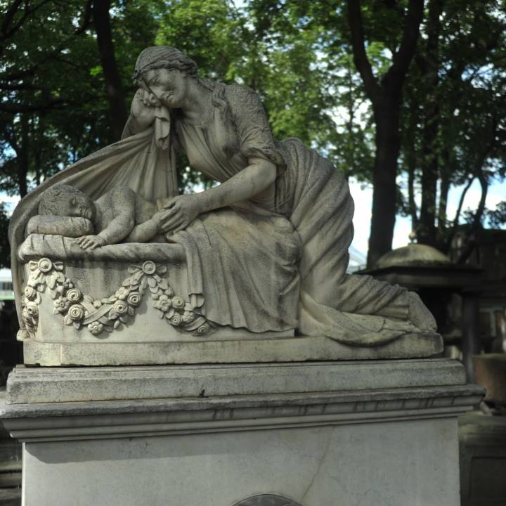 Gravestone Depicting Grieving Mother image