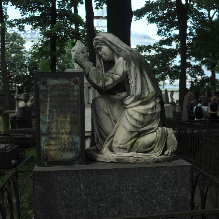 Gravestone Depicting Woman Praying image