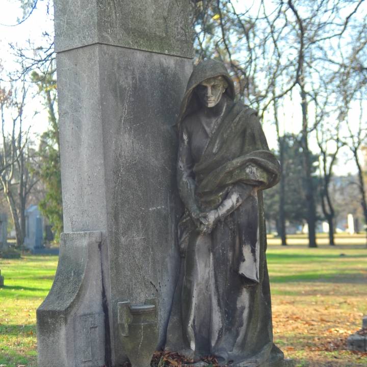 Woman Crying on a Tomb image