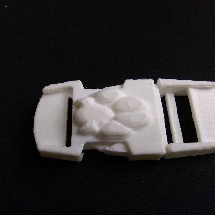 Buckle with paw image