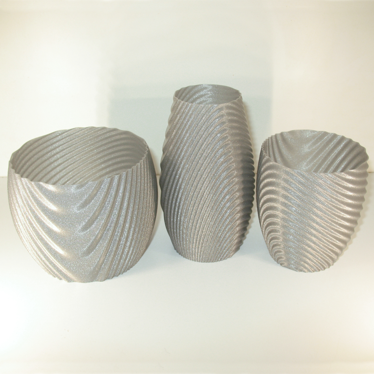 Wavy organic bowl, cups, vase and flower pot. image