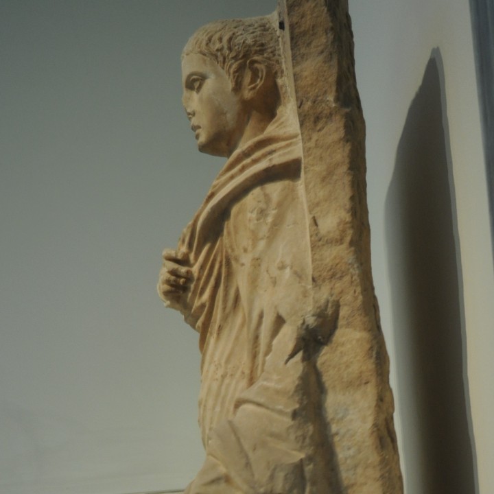 Grave stele of a youth wearing a himation image