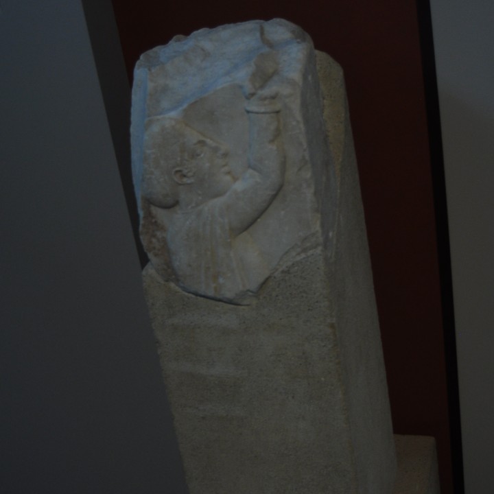 Part of an engraved funerary pillar image
