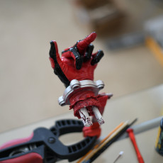 Picture of print of Severed Deadpool hand F***you