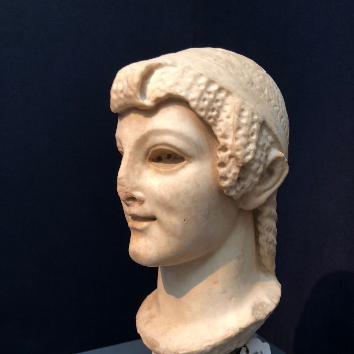 Archaistic head of a young woman image