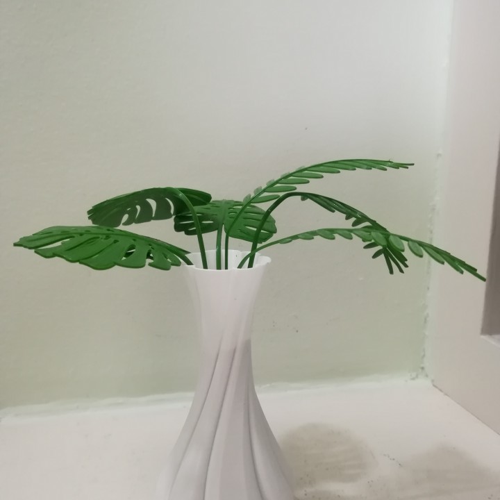 Twisted Vase with mimosa and monstera leaves image