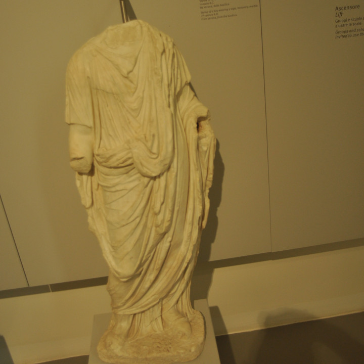 Statue of a boy wearing a toga image