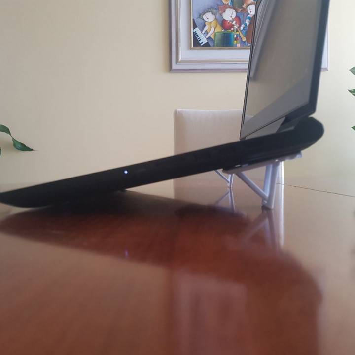 Integrated laptop riser/stand image