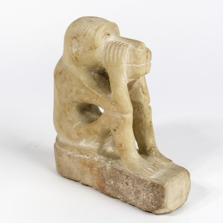 Figure of a squatting monkey image