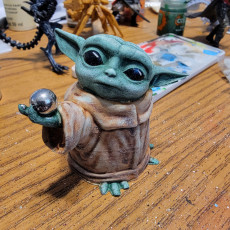 Picture of print of baby yoda with ball