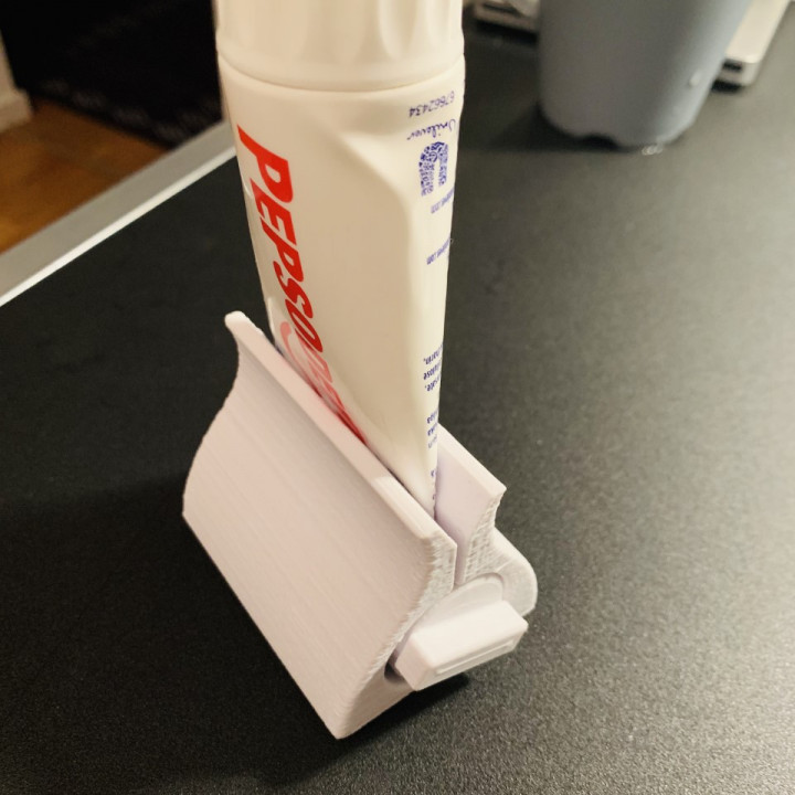 Toothpaste support clamp image
