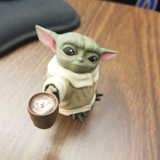 Picture of print of Baby Yoda with coffee cup